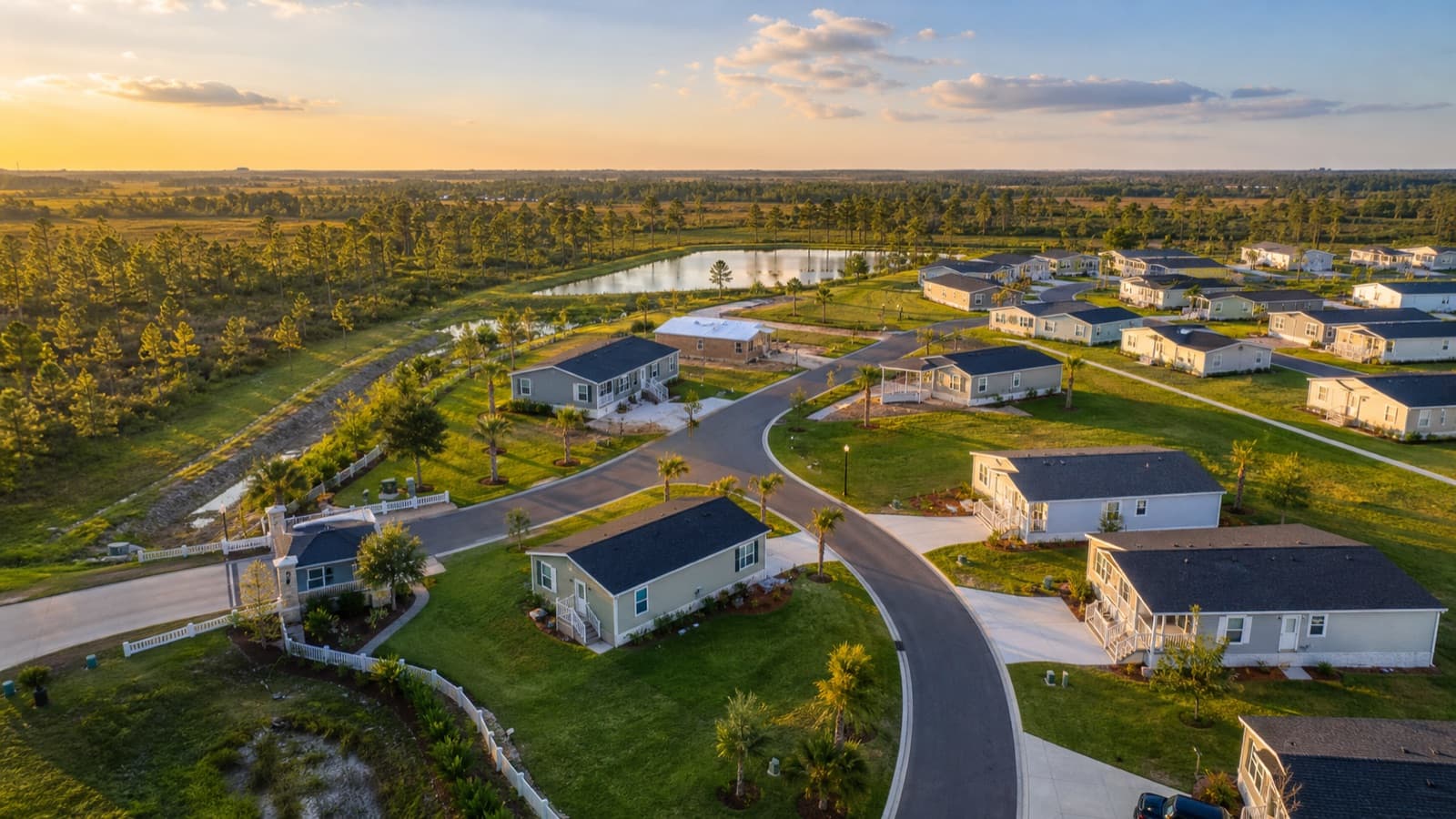 Aerial view of a manufactured-home community at golden hour